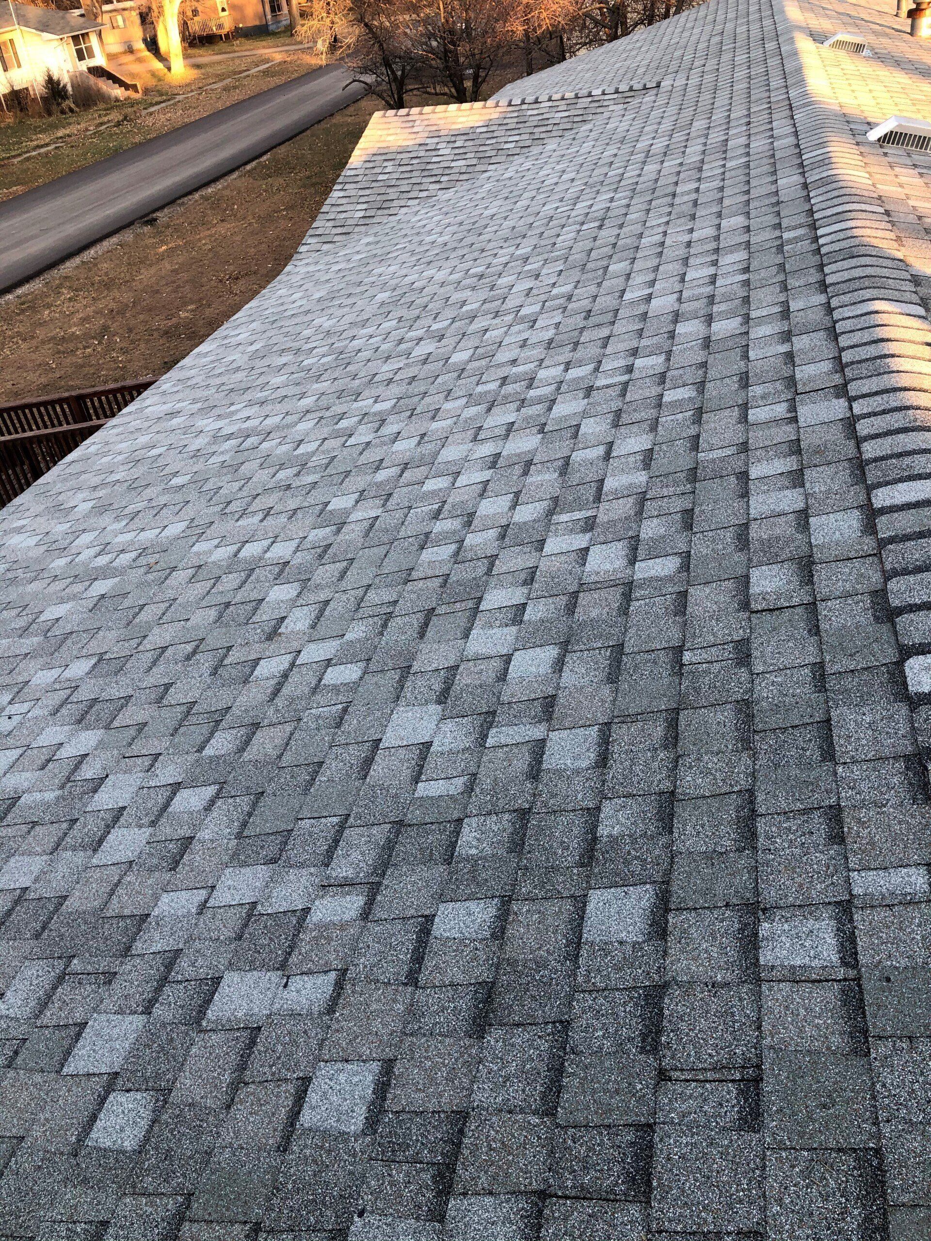 Completed asphalt shingle roof installed by Even Construction in Huron, SD
